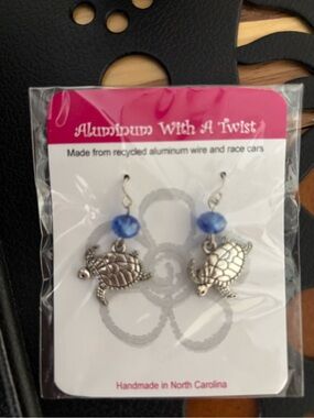 Handmade Turtle earrings
Made from recycled aluminum and race cars
